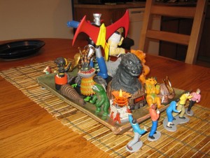 Godzilla and friends sit in the center of the Kaijucast Thanksgiving spread.